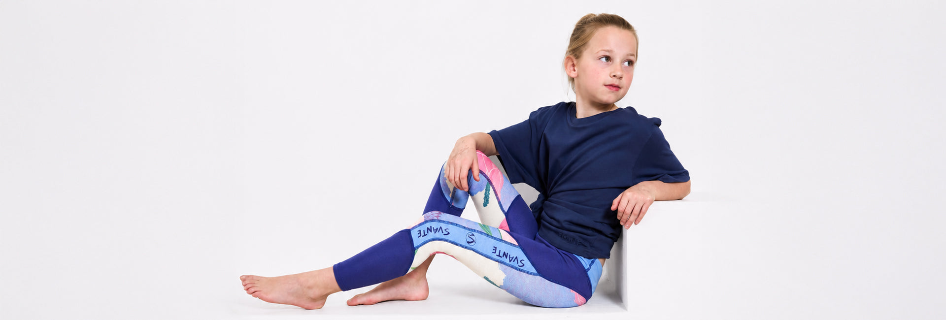two girls wearing regenerative cotton t-shirt, crop t-shirt and grey joggers