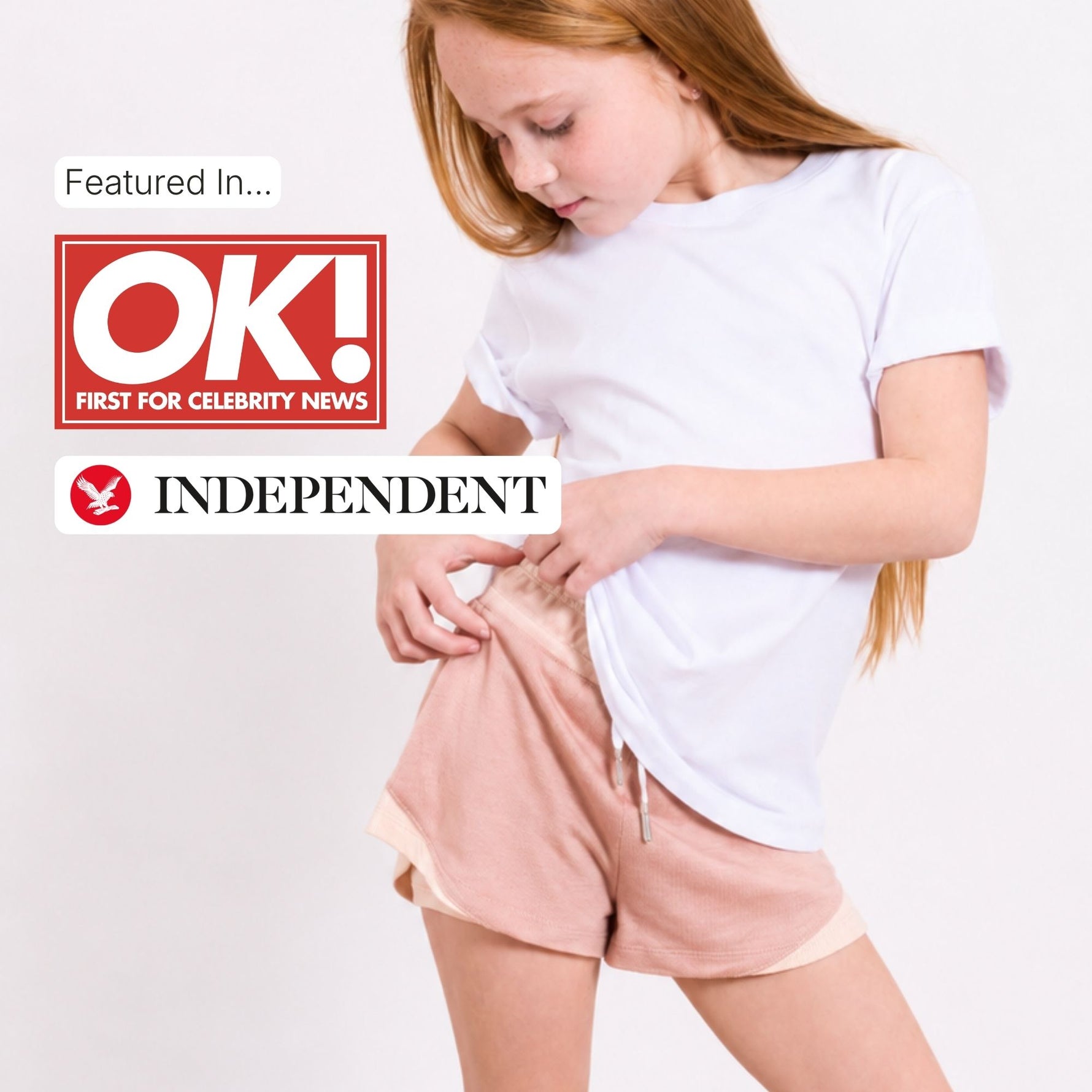 Young girl in white regenerative cotton t-shirt and plastic free pink sports shorts with OK! and Independent logos. 