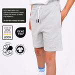 Boys Organic cotton Grey Svante jersey shorts worn by a boys with certification logos displayed on the left side. 